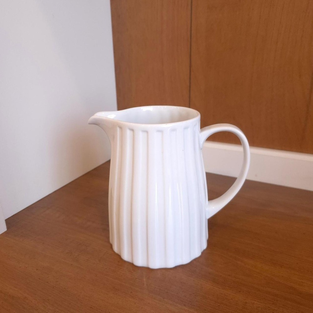 White Crate & Barrel pitcher with vertical ribbed texture